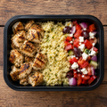 Greek souvlaki-style chicken with lemon couscous and Greek salad.