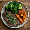 Chimichurri beef with roasted kumara and broccoli.