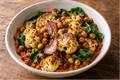 Romesco-roasted cauliflower with roasted red onion, chickpeas & spinach.